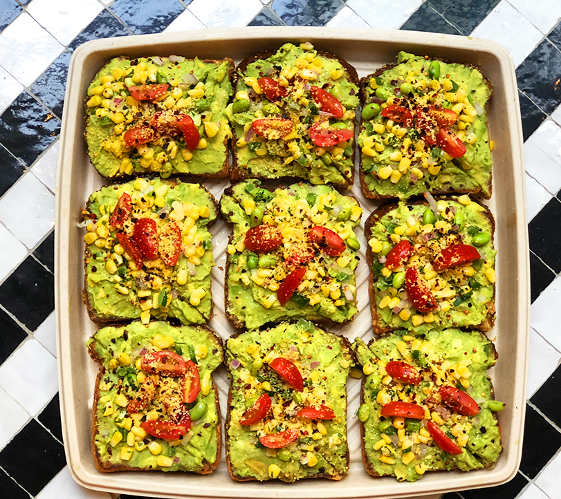 Corporate breakfast idea with avocado toasts in a tray